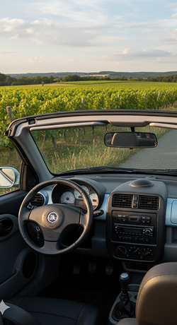 Intérieur épuré d'un cabriolet bleu clair, volant et tableau de bord noirs à Veigné près de Tours en Indre-et-Loire 37